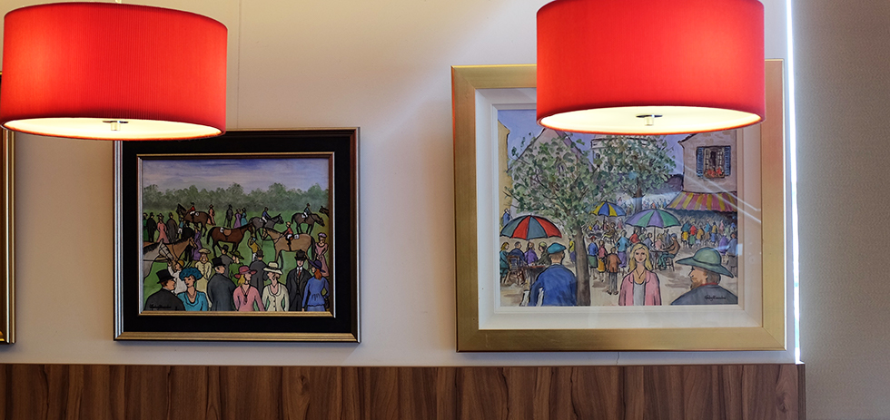 Works by Gladys Maccabe, among others, adorn the walls of Cafe Smart © Aptalops